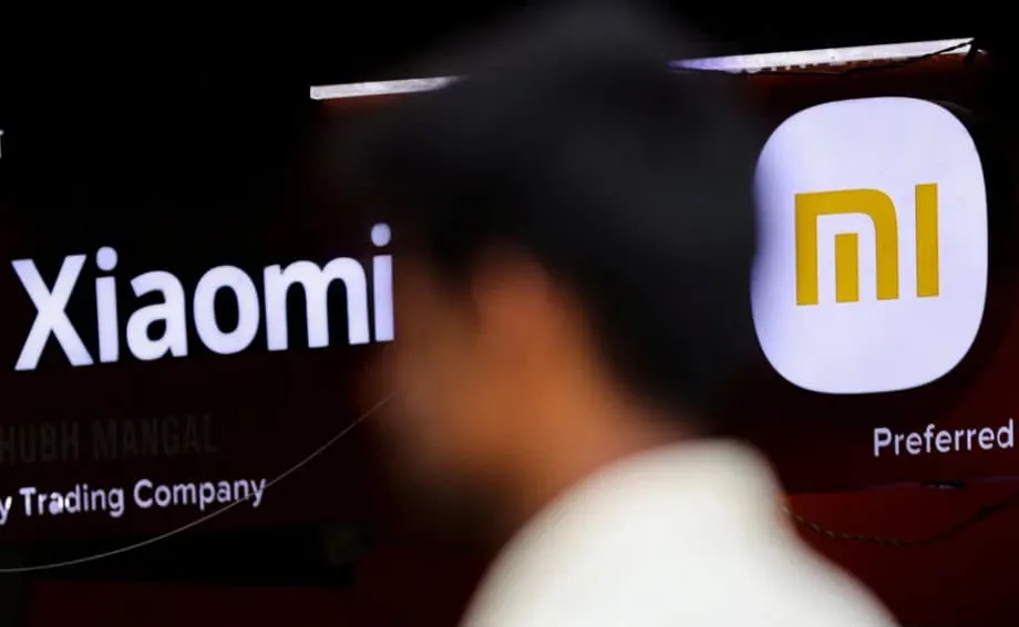 Dentro do custo humano da corrida da Xiaomi dos telemóveis aos carros elétricos